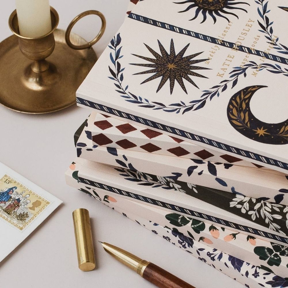 Close-up of the Blue Botanical planner’s illustrated cover and gold foil details