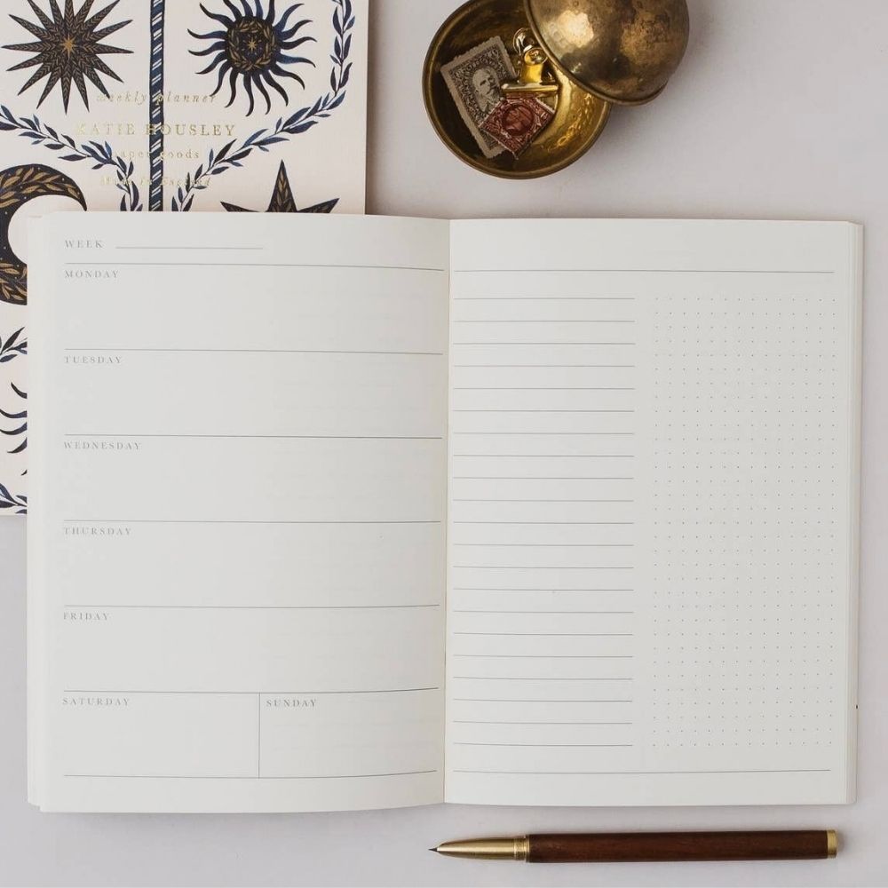 Celestial Moon A5 planner open to its undated weekly planning pages