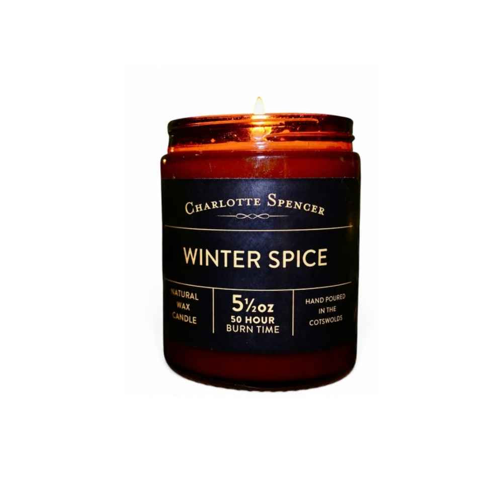 A Winter Spice candles by Charlotte Spencer in a brown glass jar. 
