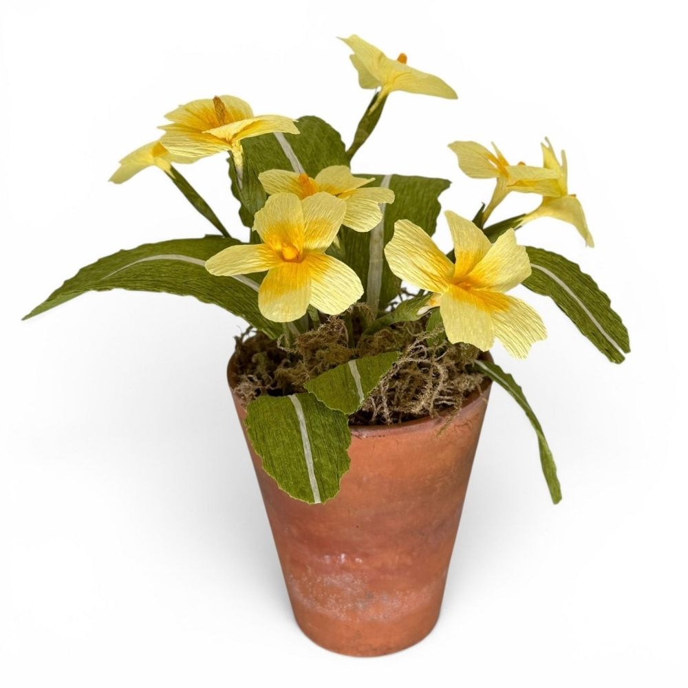 Handmade paper primroses by Gretel in a moss-topped vintage terracotta pot