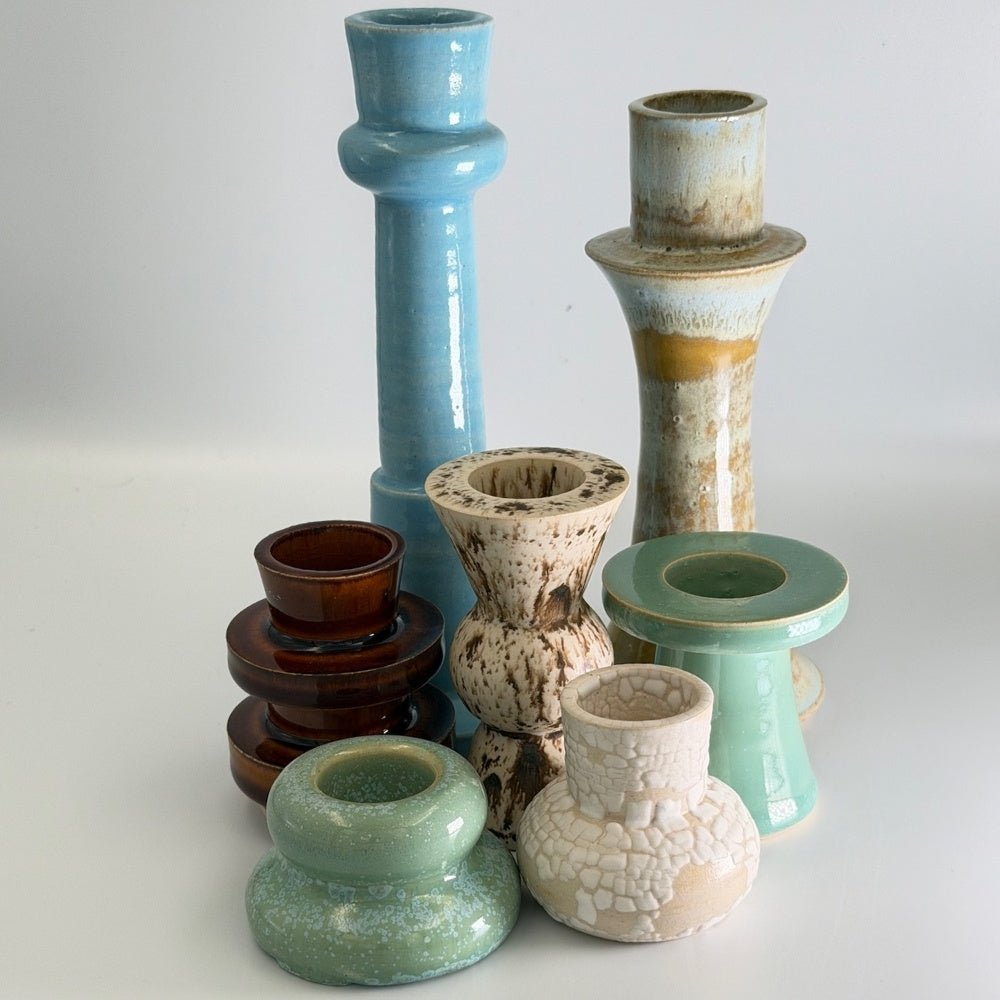Group of ceramic candlestick holders in various finishes
